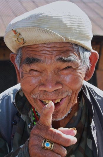 old man pointing at camera smiling