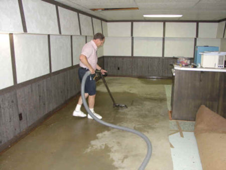 vacuuming water from the ground flooded basement