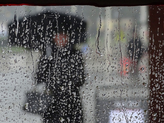 Spring Rains Rain on camera women with umbrella background