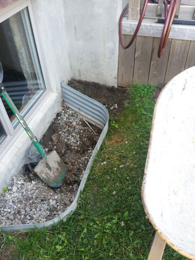 Window well before | Ashworth Drainage Window well before work