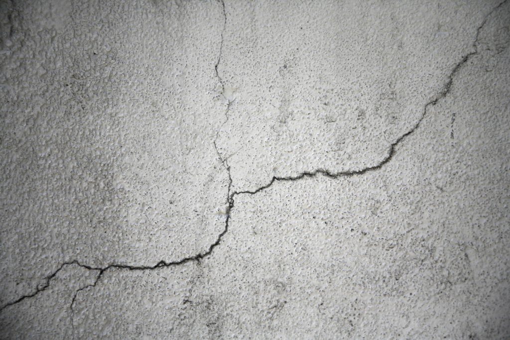 crack in white plaster wall