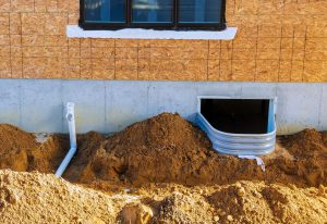 window well surrounded by french drain
