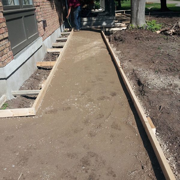 Concrete sidewalk construction basement flooding yard floodoing